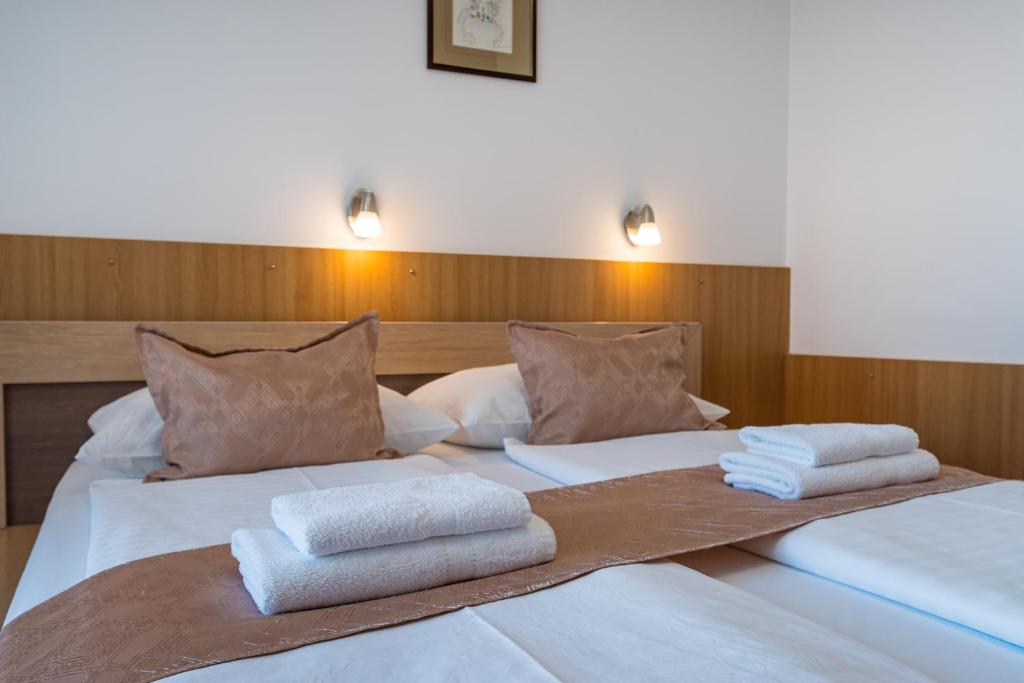 Postelja oz. postelje v sobi nastanitve Hotel Vicko