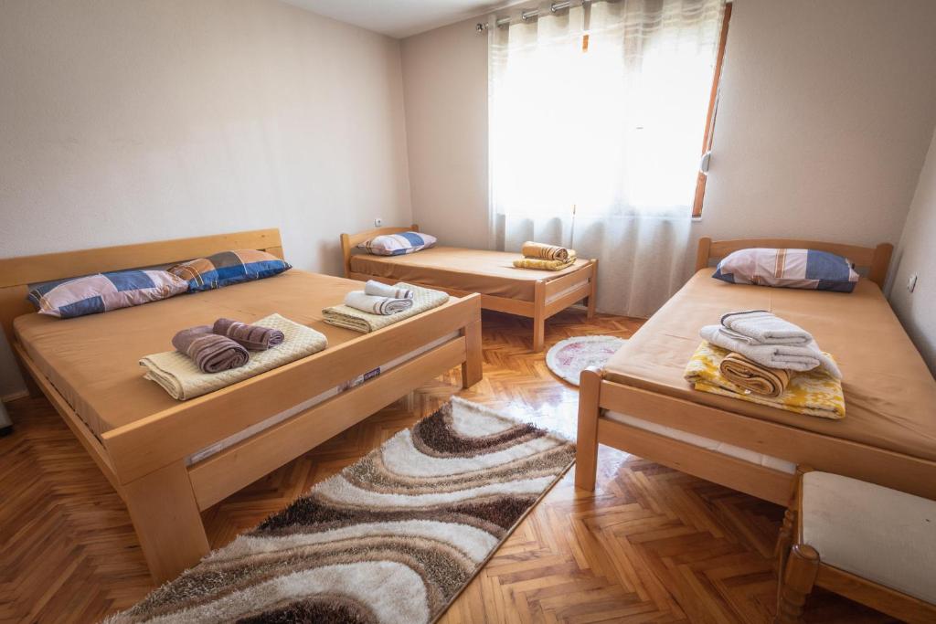 Postel nebo postele na pokoji v ubytování Guest House - Axios