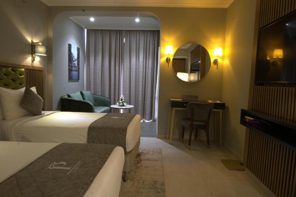 Postel nebo postele na pokoji v ubytování President Hotel