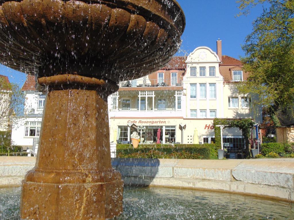 a water fountain in the middle of a city at Hotel Rosengarten in Bad Salzuflen