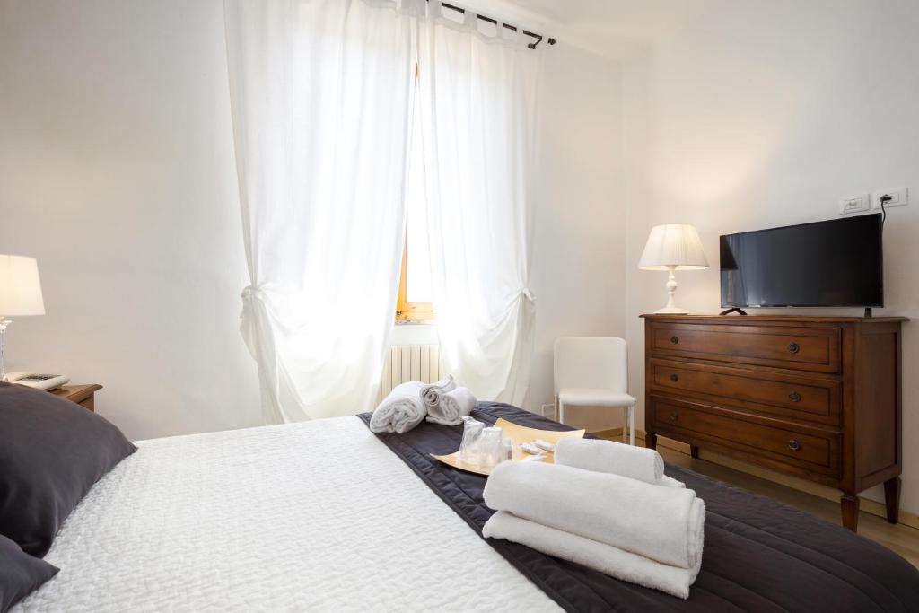 Postel nebo postele na pokoji v ubytování Hotel Porta Romana di Luce Hotels