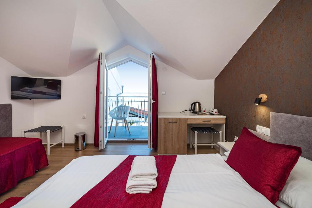 Postelja oz. postelje v sobi nastanitve Hotel Vicko