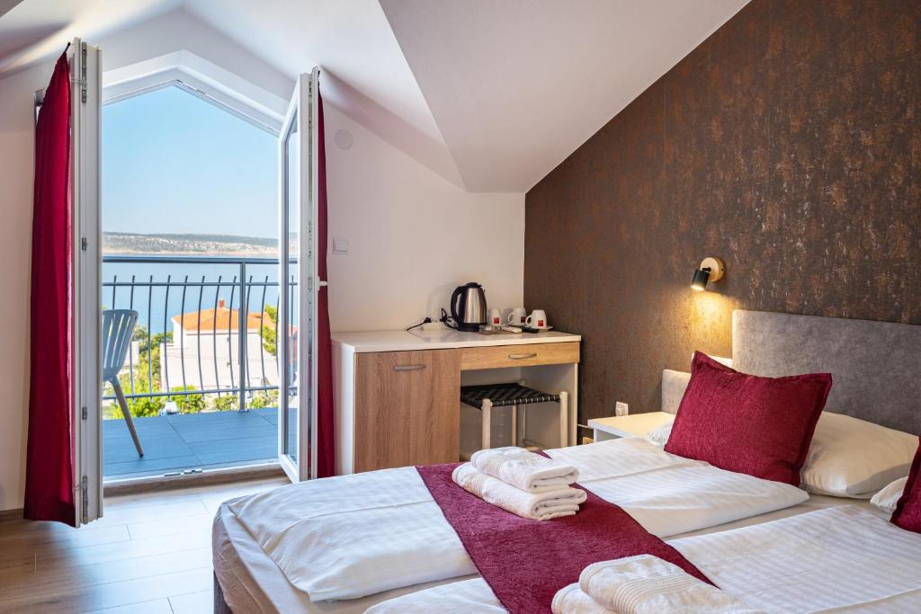Postelja oz. postelje v sobi nastanitve Hotel Vicko