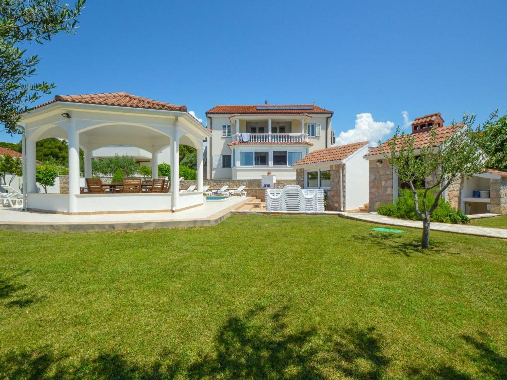 a large house with a gazebo in a yard at Apartment Aquanur-5 by Interhome in Sovlje