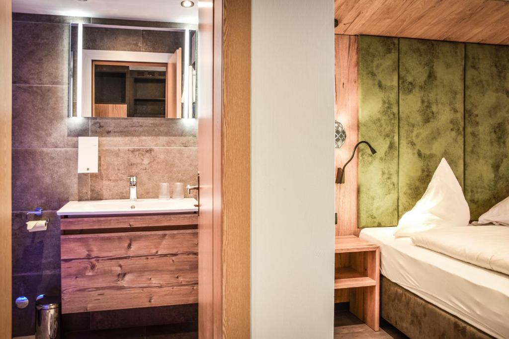 Postel nebo postele na pokoji v ubytování Hotel Grieserhof