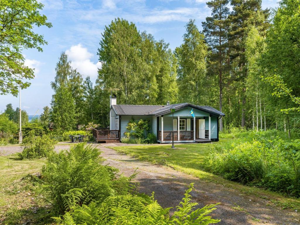 a small house in the middle of a forest at Chalet Bengtstorp by Interhome in Gyttorp