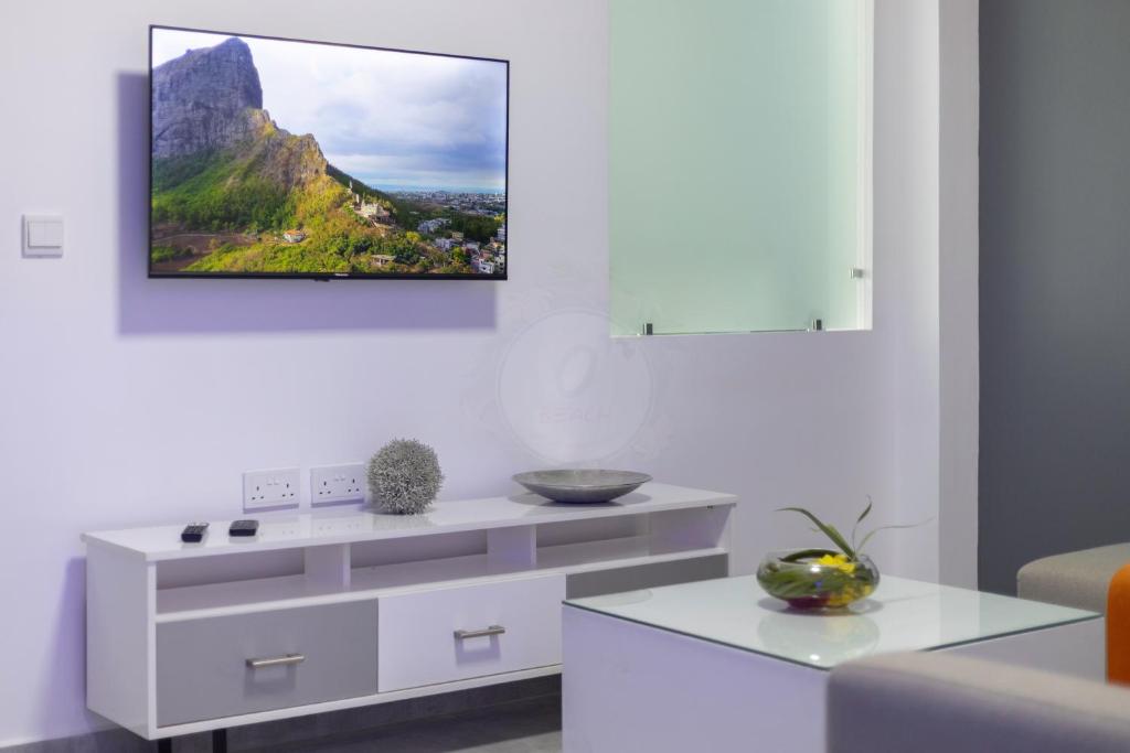 TV a/nebo společenská místnost v ubytování O'Beach Boutique Studios
