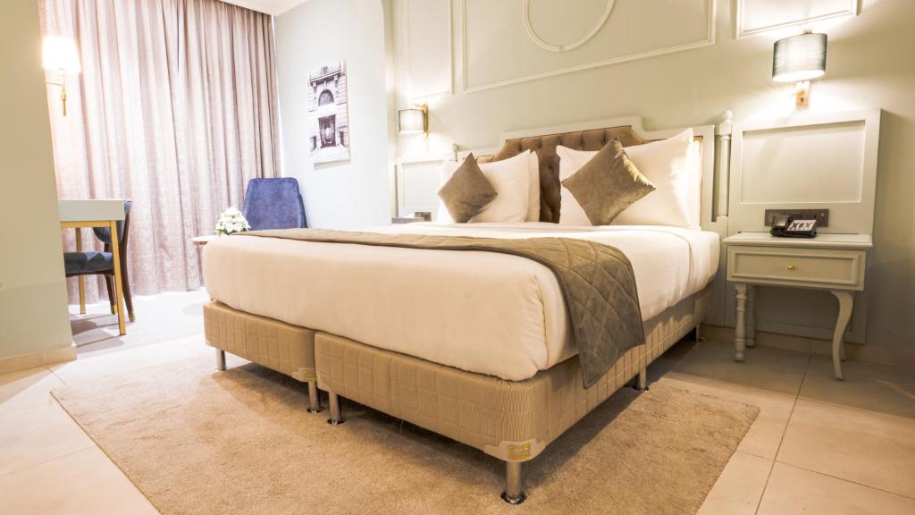 Postel nebo postele na pokoji v ubytování President Hotel