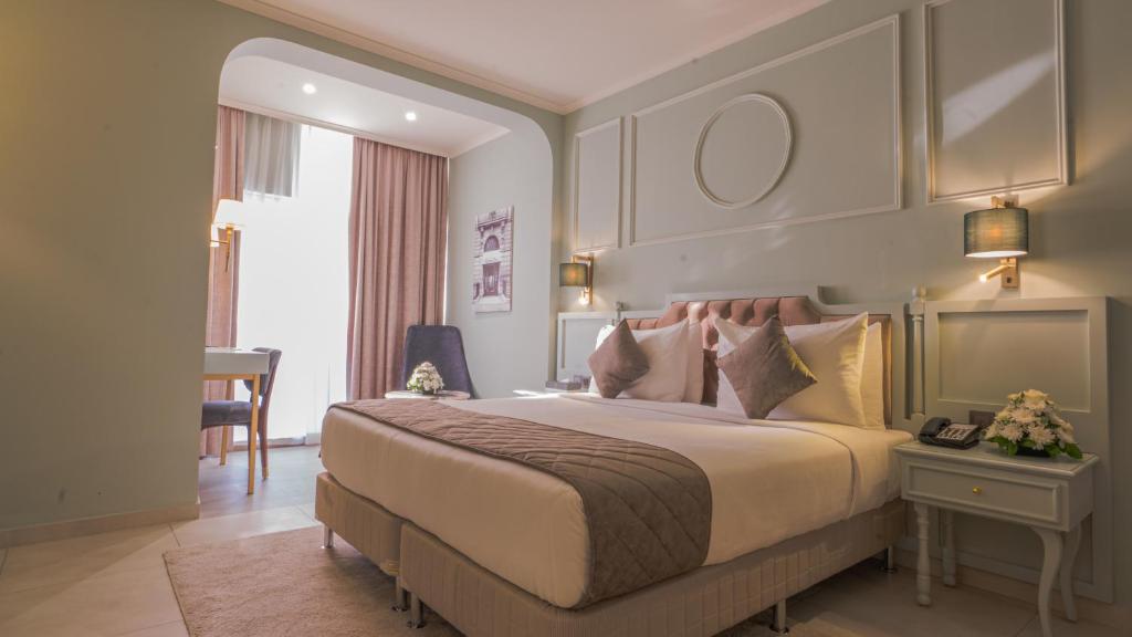 Postel nebo postele na pokoji v ubytování President Hotel