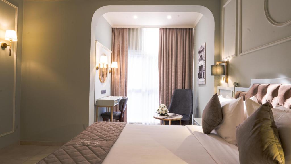 Postel nebo postele na pokoji v ubytování President Hotel