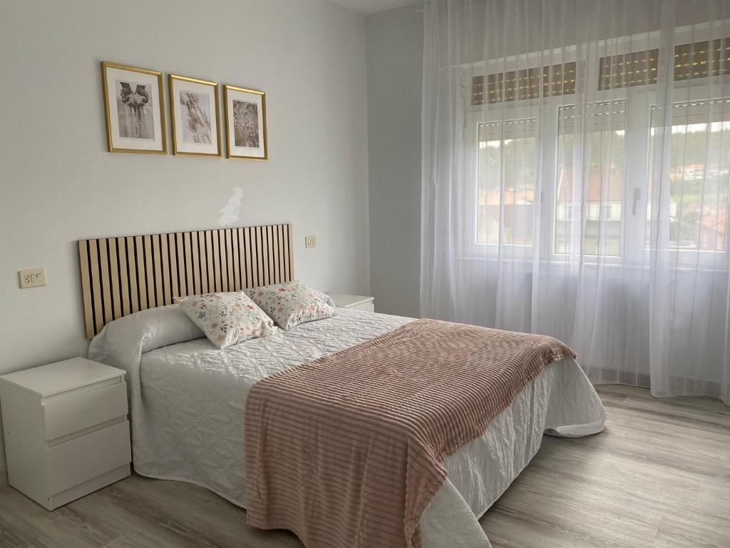 Ένα ή περισσότερα κρεβάτια σε δωμάτιο στο A Xaneiriña