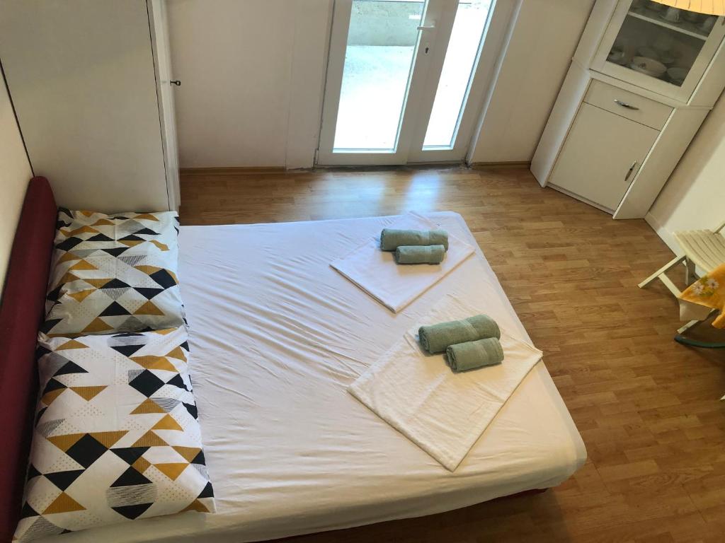 Posteľ alebo postele v izbe v ubytovaní Apartmani Glavina