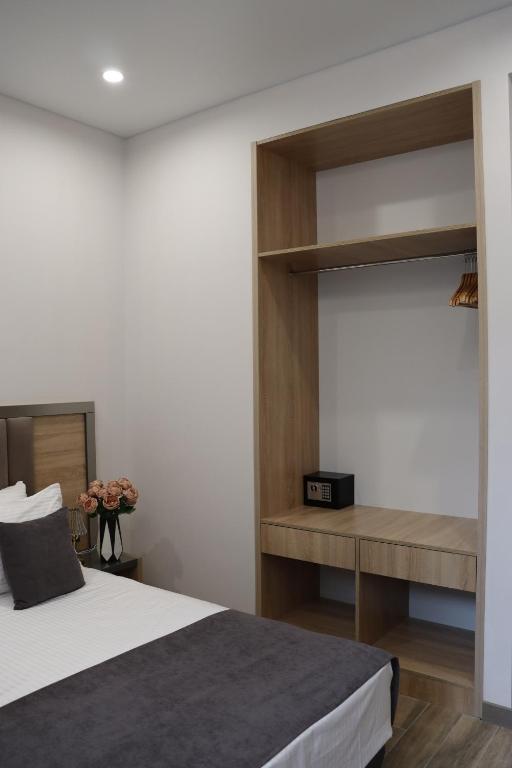 Postel nebo postele na pokoji v ubytování Orion ApartHotel