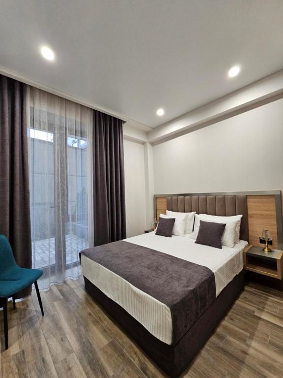 Postel nebo postele na pokoji v ubytování Orion ApartHotel