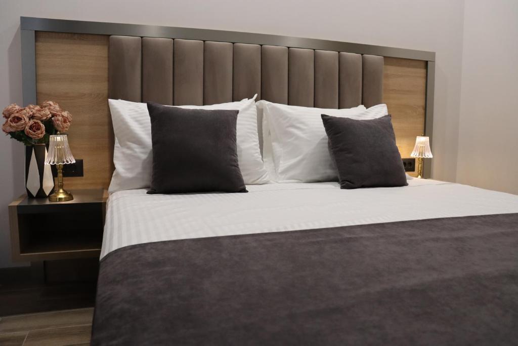 Postel nebo postele na pokoji v ubytování Orion ApartHotel