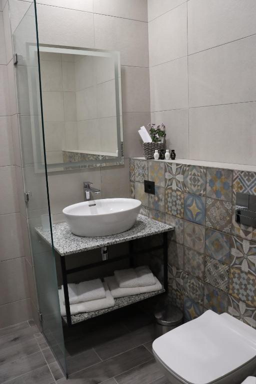 Koupelna v ubytování Orion ApartHotel