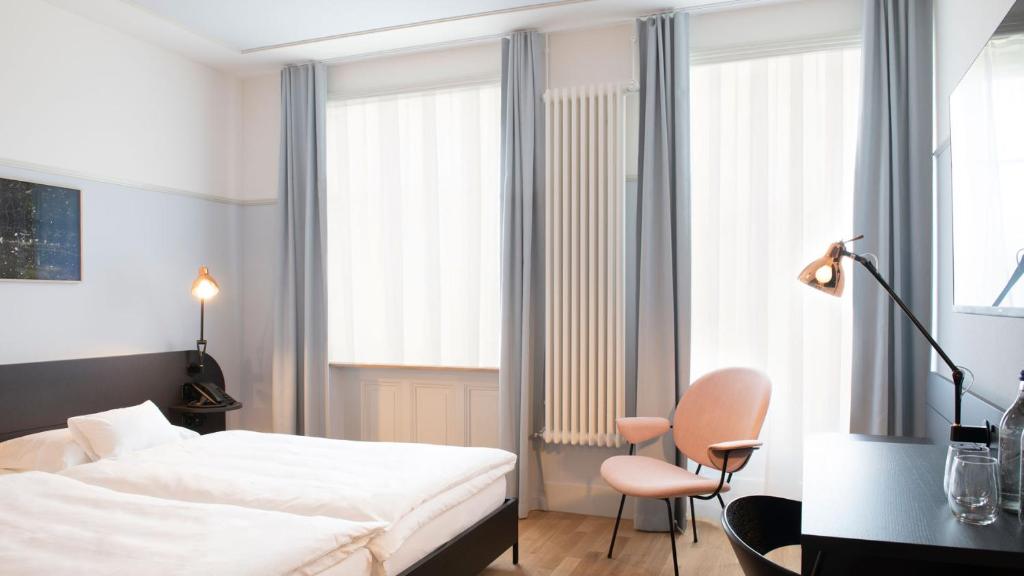 Postel nebo postele na pokoji v ubytování Hotel Schützen Rheinfelden