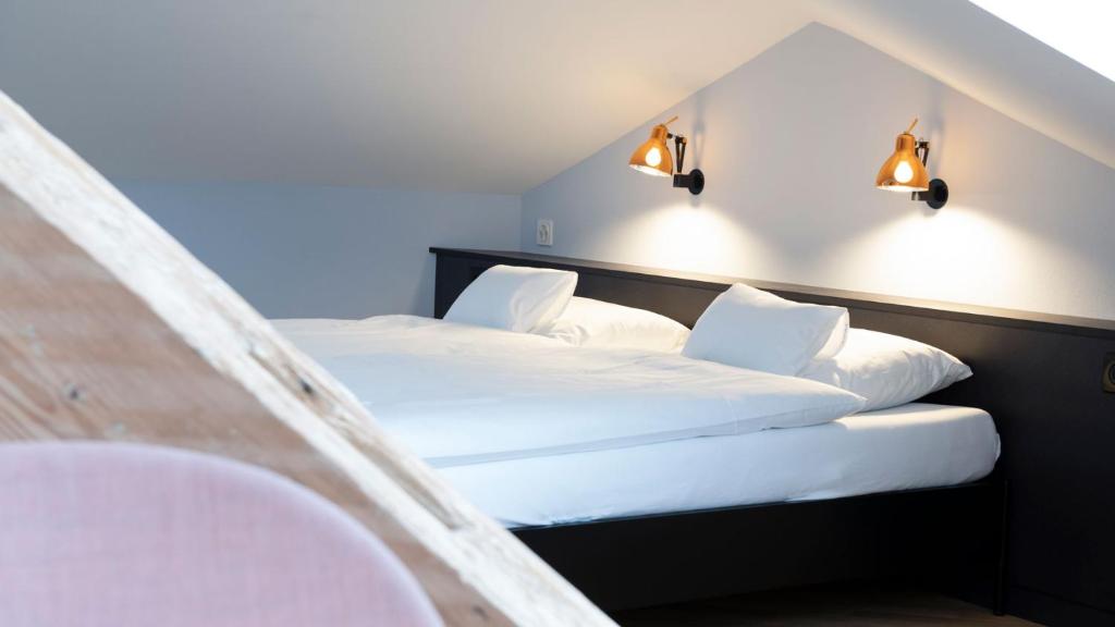 Postel nebo postele na pokoji v ubytování Hotel Schützen Rheinfelden