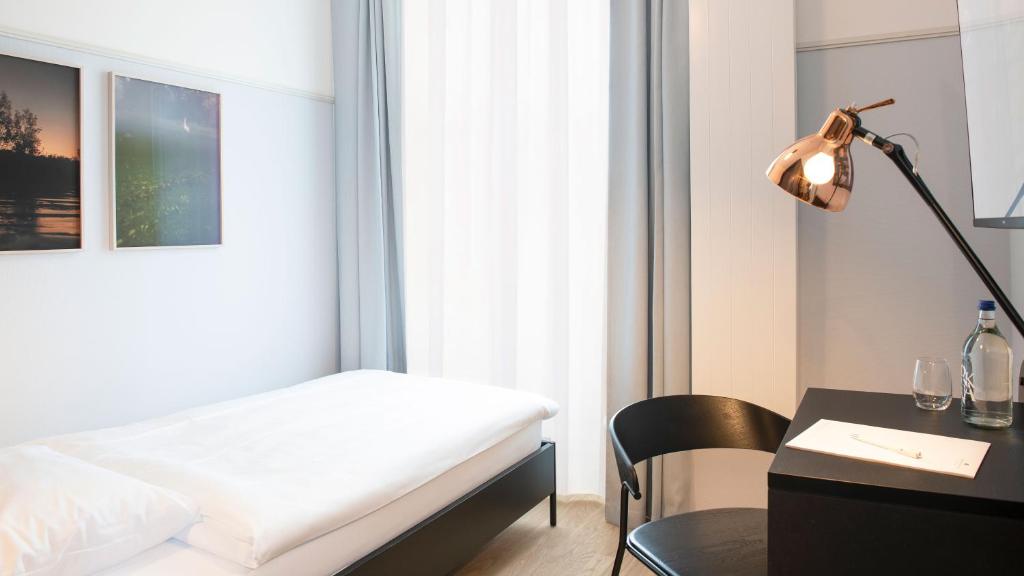 Postel nebo postele na pokoji v ubytování Hotel Schützen Rheinfelden