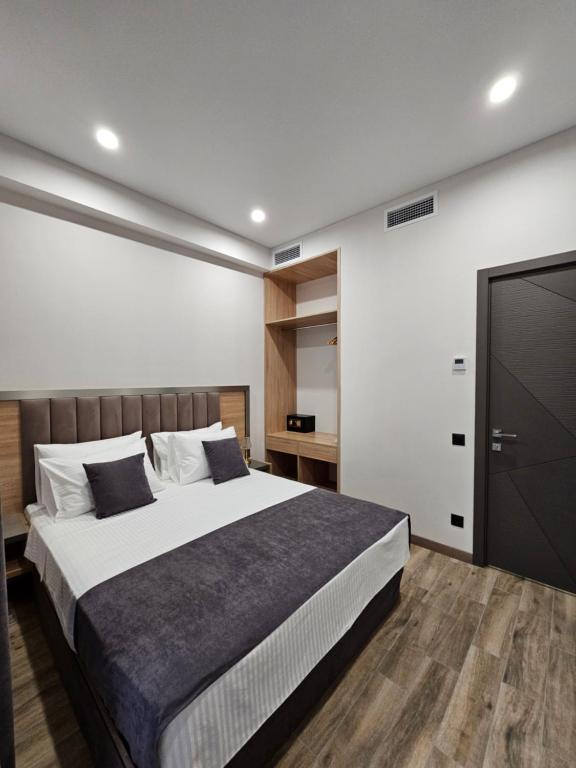 Postel nebo postele na pokoji v ubytování Orion ApartHotel