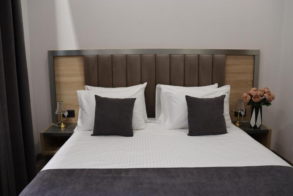 Postel nebo postele na pokoji v ubytování Orion ApartHotel