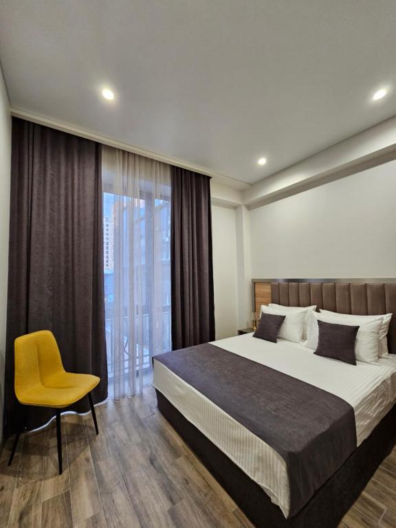 Postel nebo postele na pokoji v ubytování Orion ApartHotel