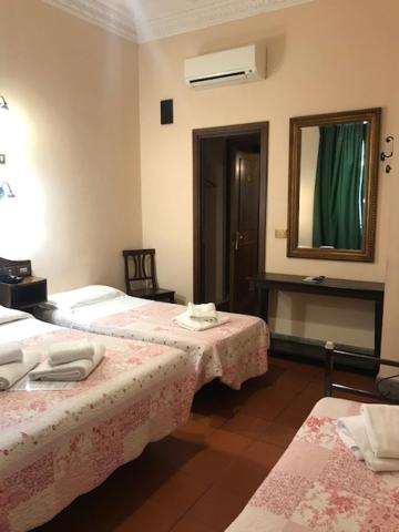 Postel nebo postele na pokoji v ubytování Hotel Panda
