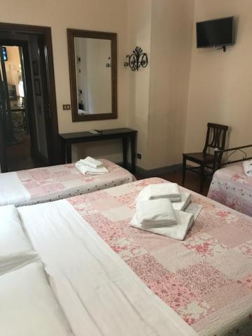 Postel nebo postele na pokoji v ubytování Hotel Panda