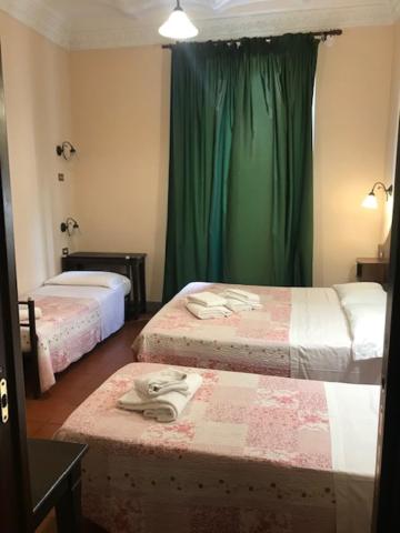 Postel nebo postele na pokoji v ubytování Hotel Panda