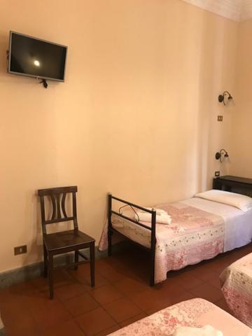 Postel nebo postele na pokoji v ubytování Hotel Panda