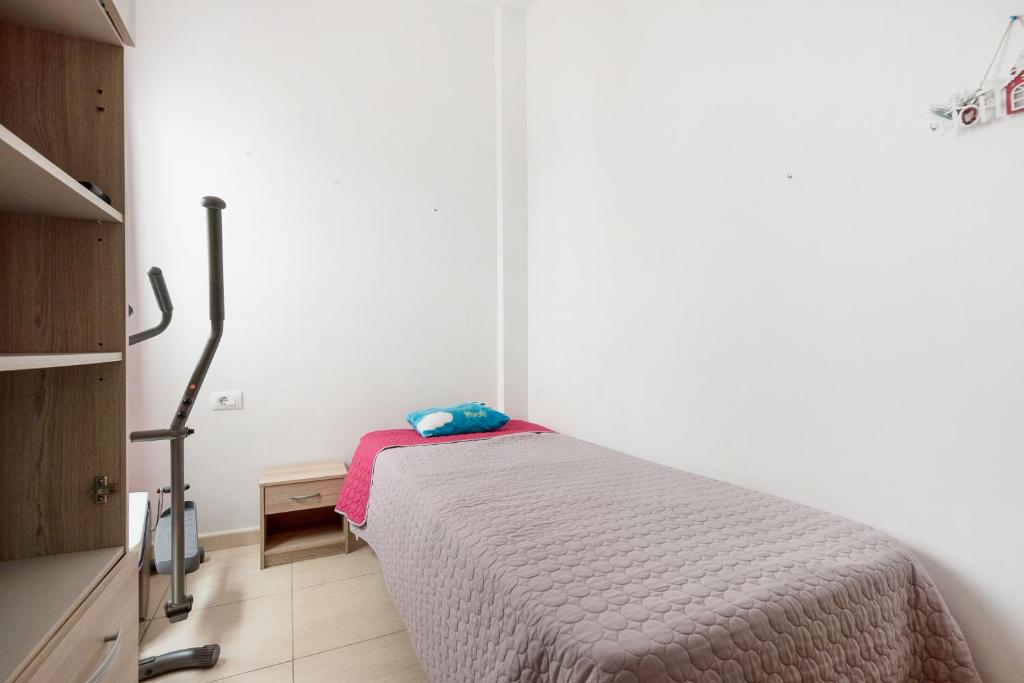 Posteľ alebo postele v izbe v ubytovaní Apartamento Elena