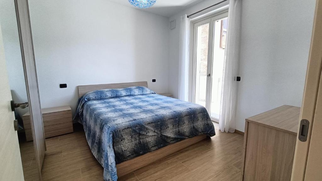 Postel nebo postele na pokoji v ubytování Casa del Net - Tremezzo