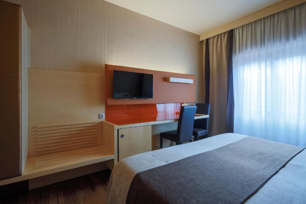 TV a/nebo společenská místnost v ubytování Hotel Velino
