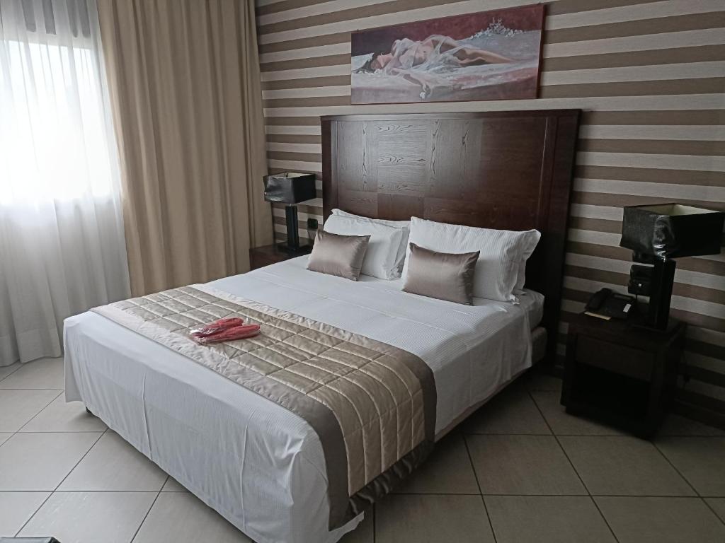 Кровать или кровати в номере Green Hotel Ninfa
