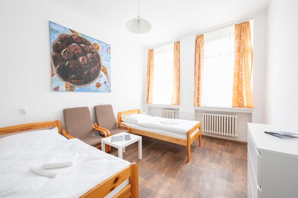 Postel nebo postele na pokoji v ubytování Lázně Meziboří