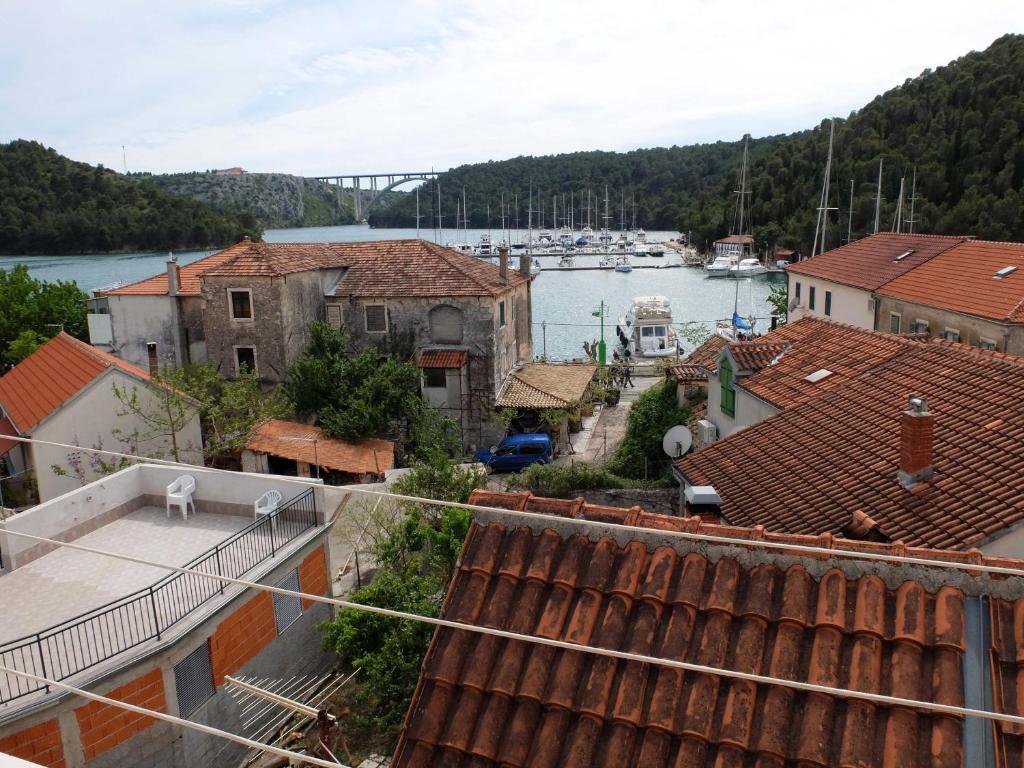 a view of a harbor from the roofs of buildings at Apartments Duilo in Skradin