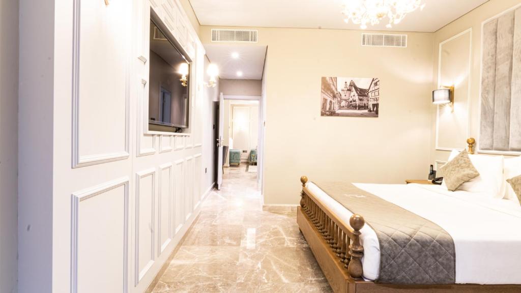 Postel nebo postele na pokoji v ubytování President Hotel