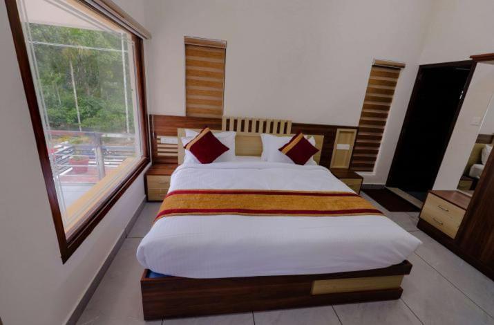 Postel nebo postele na pokoji v ubytování Greenfield Homestay