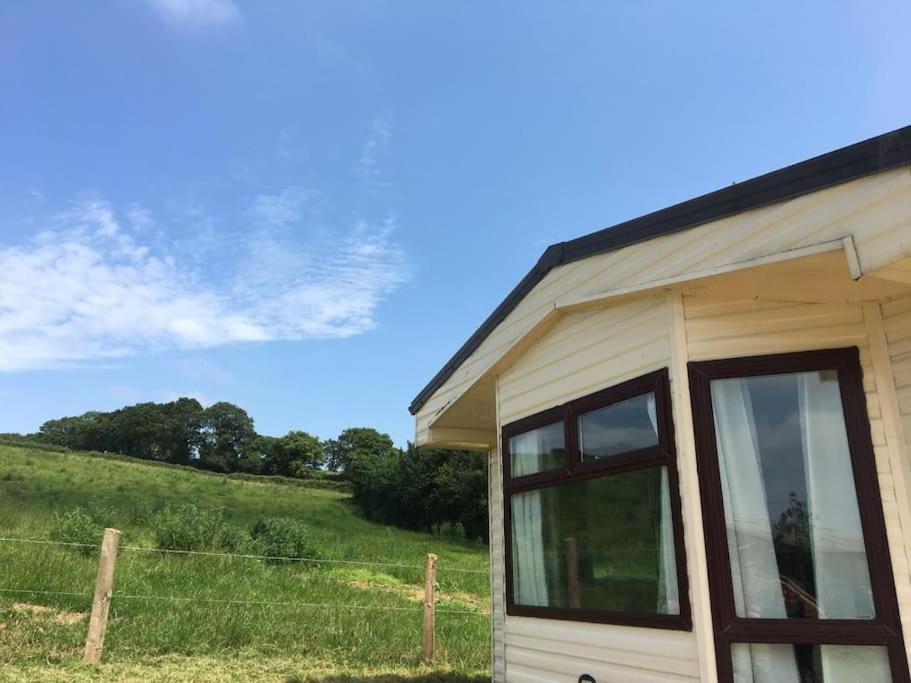a tiny house with a view of a field at Park gate house farm holidays, Colyton-‘Elizabeth in Colyton