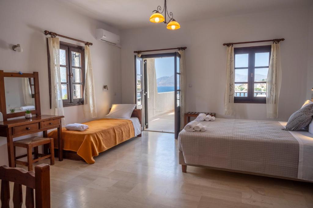 Postel nebo postele na pokoji v ubytování Pelagos Seafront Accommodation - George