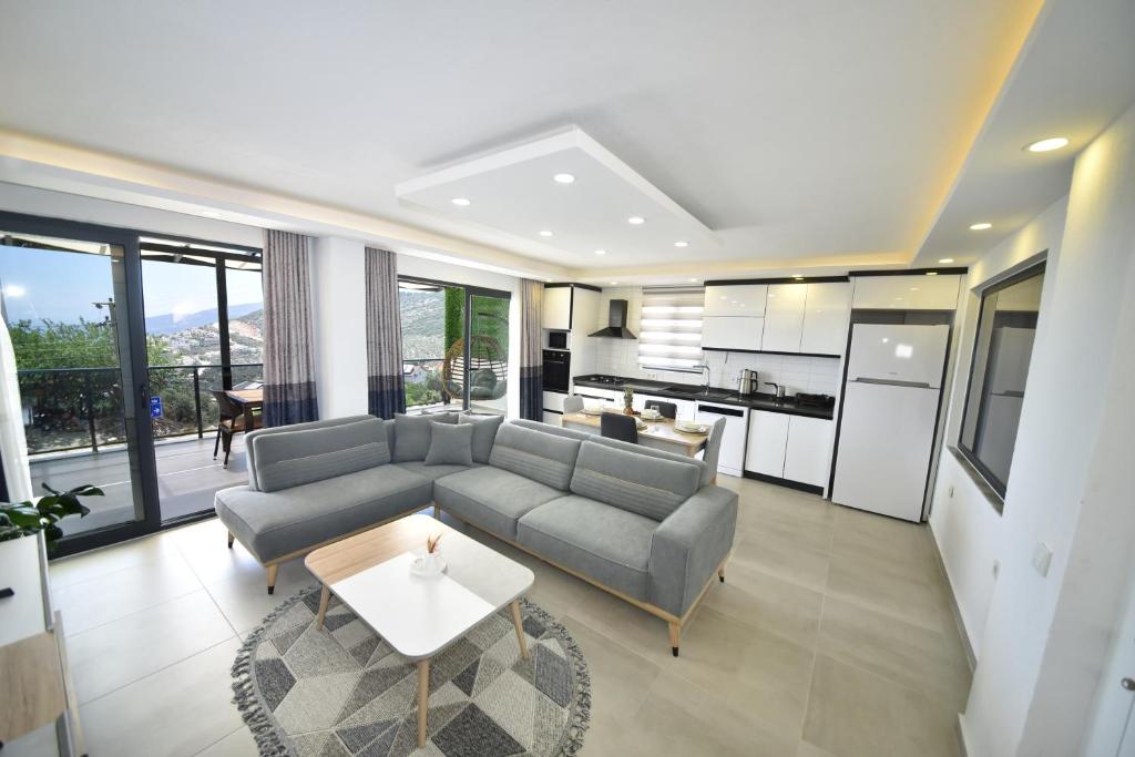 a living room with a couch and a table at Mayda Suit Aparts in Kas