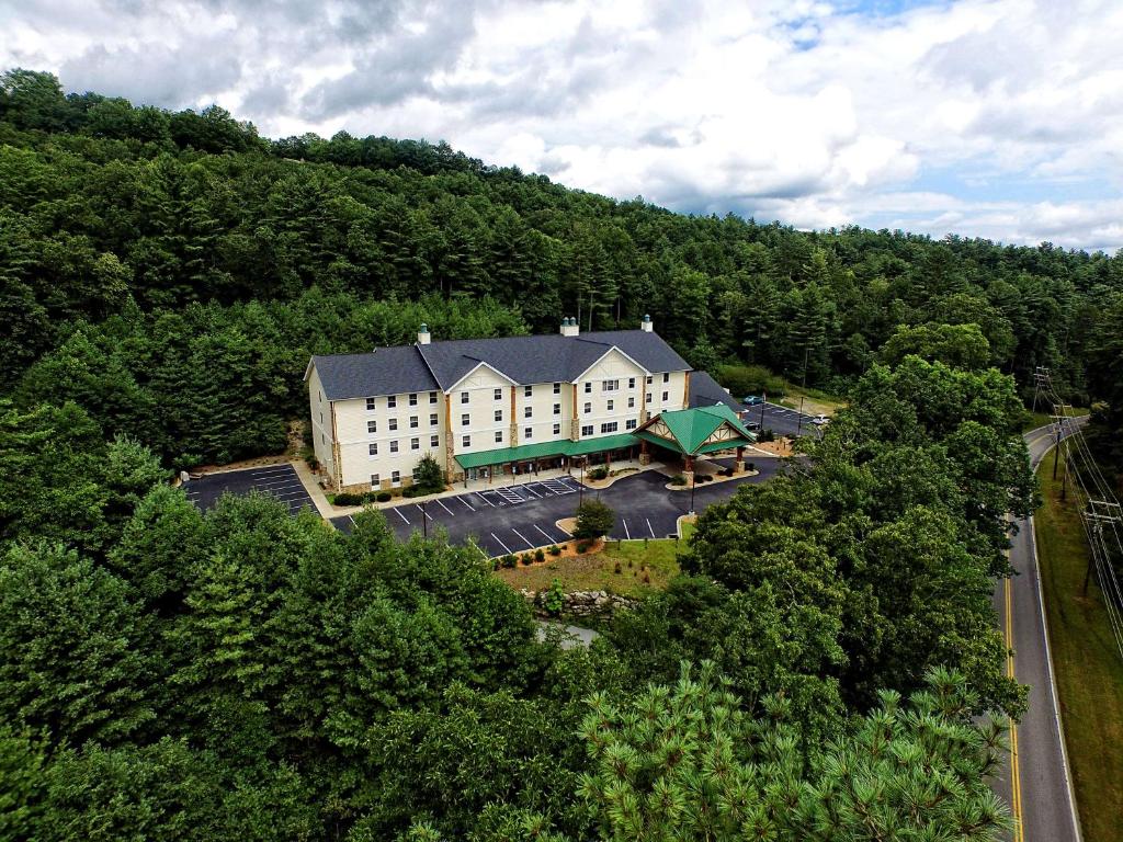 an aerial view of a building in the middle of a forest at Hampton Inn & Suites Cashiers - Sapphire Valley in Sapphire