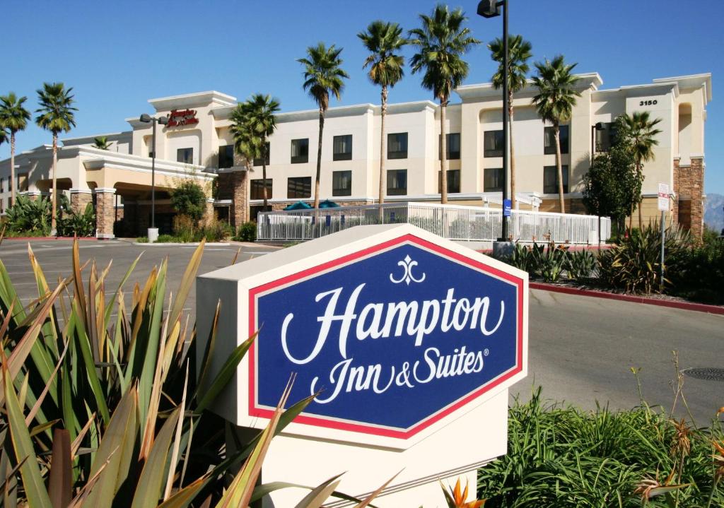 a sign for a hampton inn and suites at Hampton Inn & Suites Chino Hills in Chino Hills