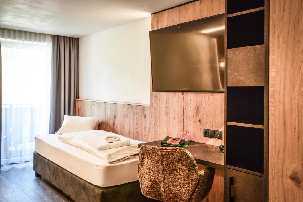 Postel nebo postele na pokoji v ubytování Hotel Grieserhof