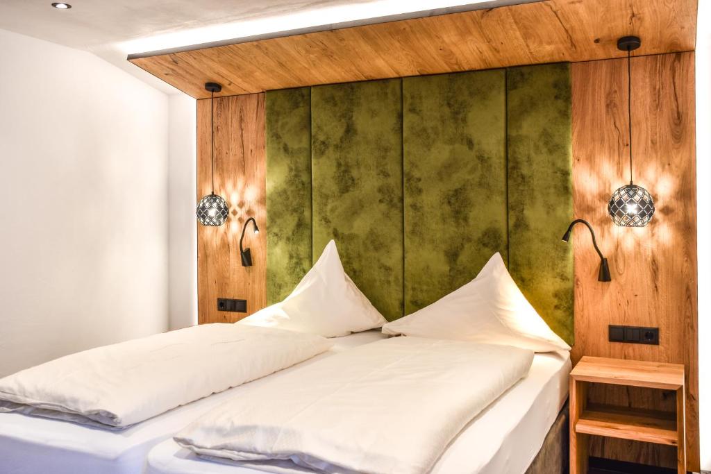 Postel nebo postele na pokoji v ubytování Hotel Grieserhof