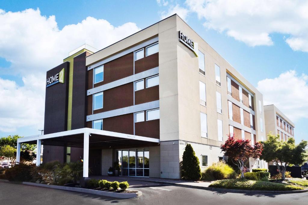 an office building with the word hotel on it at Home2 Suites by Hilton Columbus in Columbus