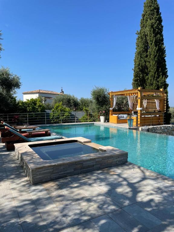 a large swimming pool with a playground in the middle at Escondida in Nice