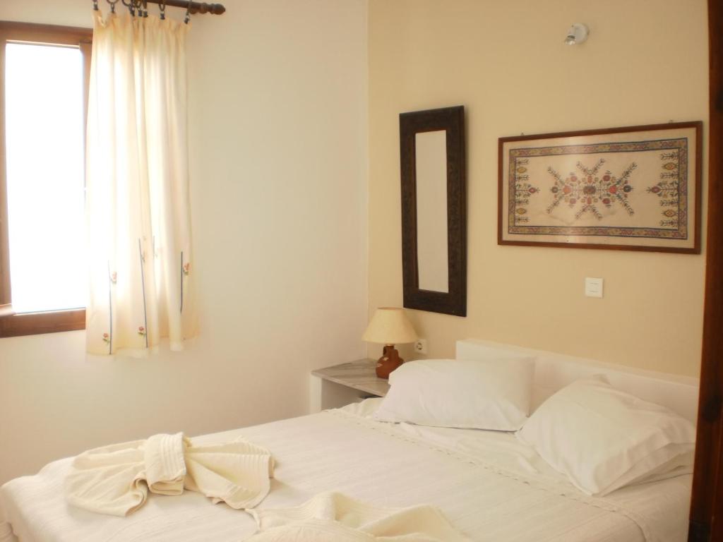 Postel nebo postele na pokoji v ubytování Bungalows Svoronos