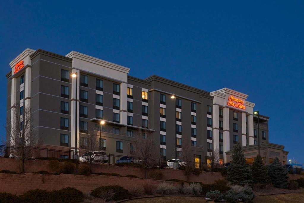 a hotel building with a sign on it at night at Hampton Inn & Suites Denver/Highlands Ranch in Littleton