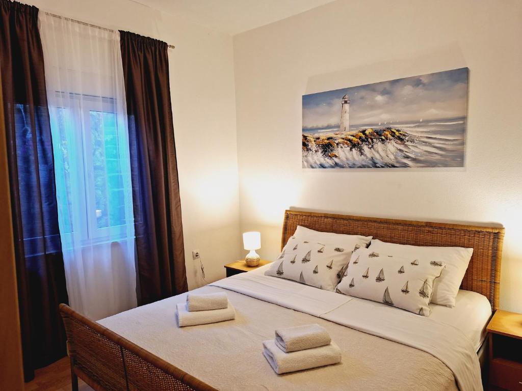 A bed or beds in a room at Apartman Marin - Zadar